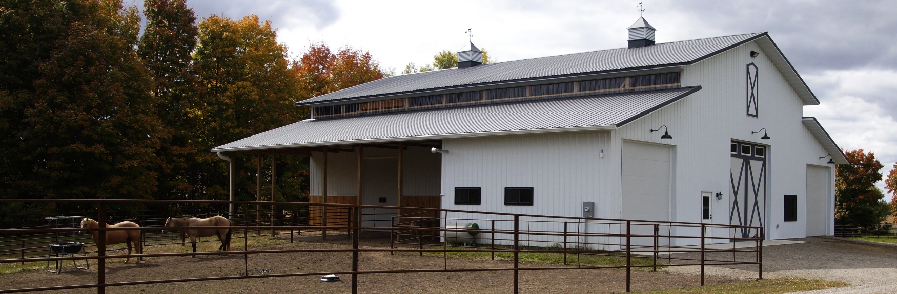 Weinberg Equestrian Barn with fence in front