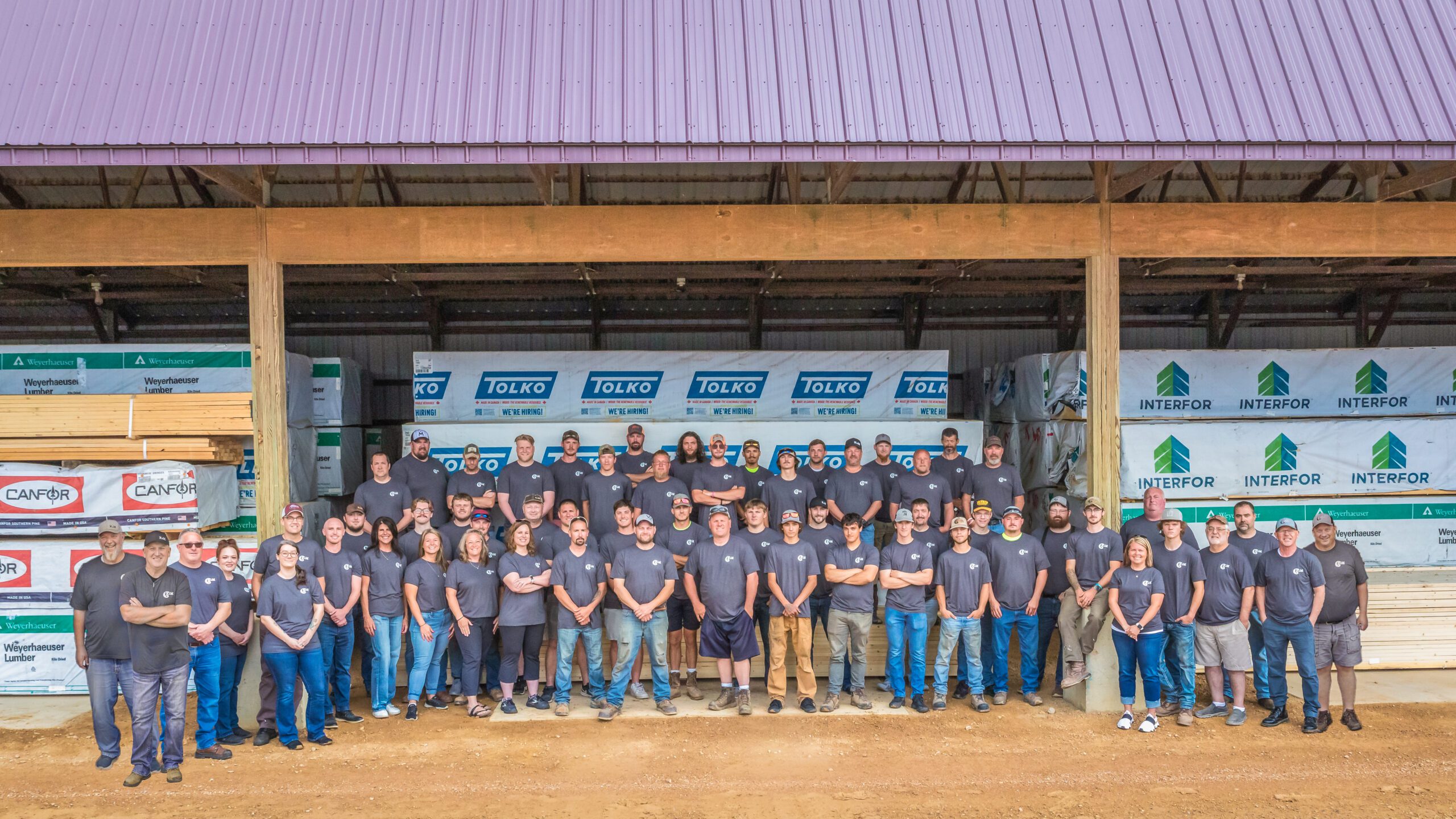 2025 RAM employees in front of building materials