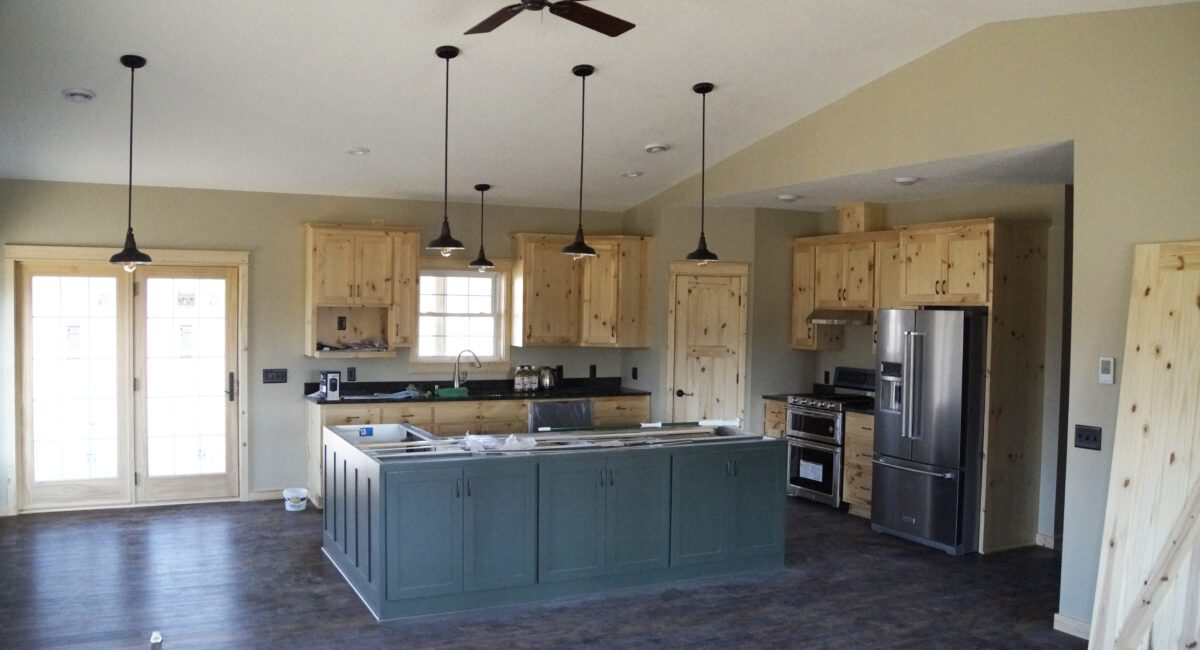 RAM 19-481 Interior of building showing kitchen space with blue island