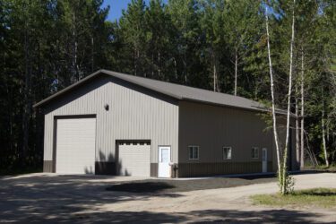 RAM 20-674 Front of building, surrounded by trees
