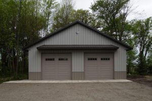 RAM 20-890 Front of building straight on showing gravel driveway.