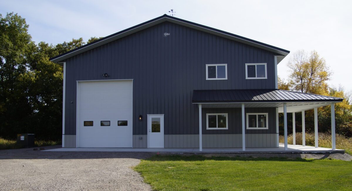 RAM 20-891 Front of building showing large garage doors and porch