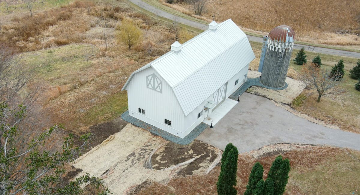 RAM 21-137 Aerial view front left side showing driveway and road behind building
