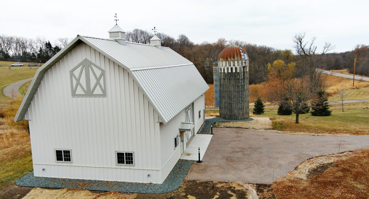 RAM 21-137 Left side view of storage building with driveway and silo on right