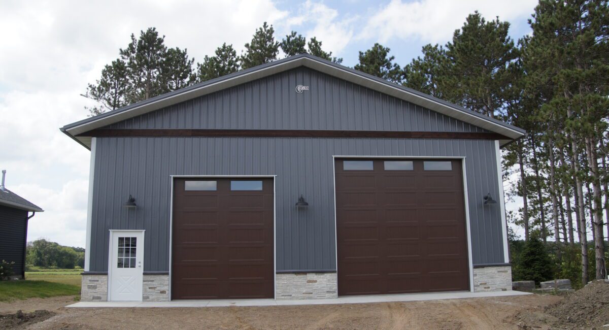 RAM 21-178 Front view of building, showing 2 large garage doors and main entrance on left side