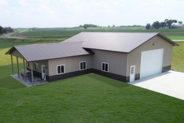 RAM 22-333 Front right view of building showing front garage door facing driveway with left side section with porch