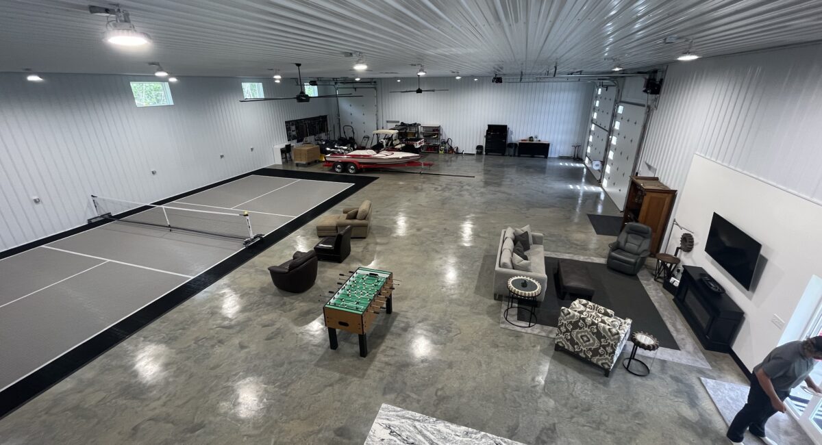 RAM 22-377 Interior of garage/storage space with media area and pickleball court