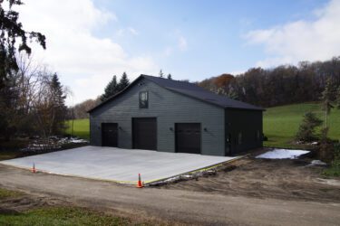 RAM 23-605 Front of building from right angle with fresh concrete drive
